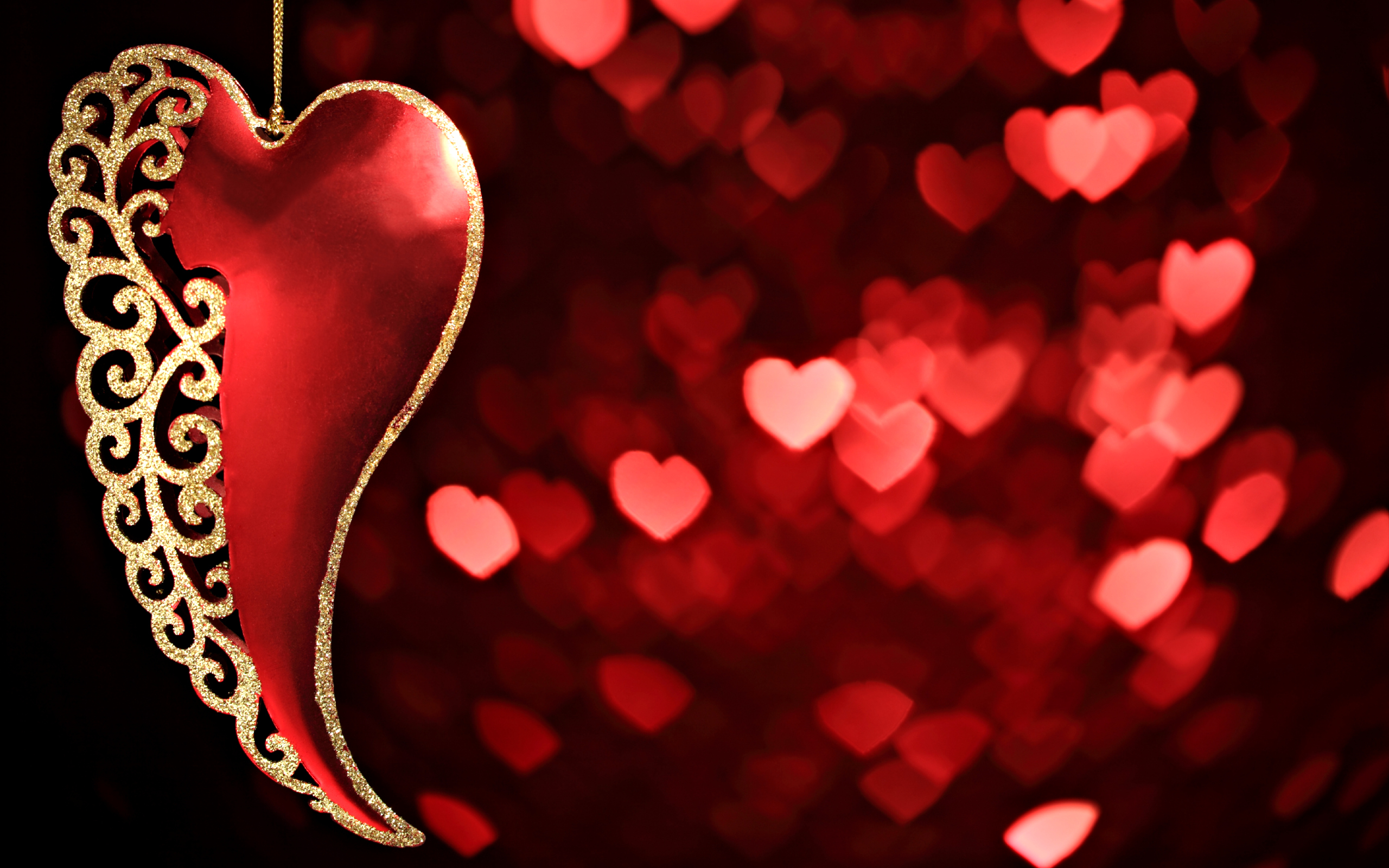 2560x1600 Blurry red hearts at background Happy Valentine's Day