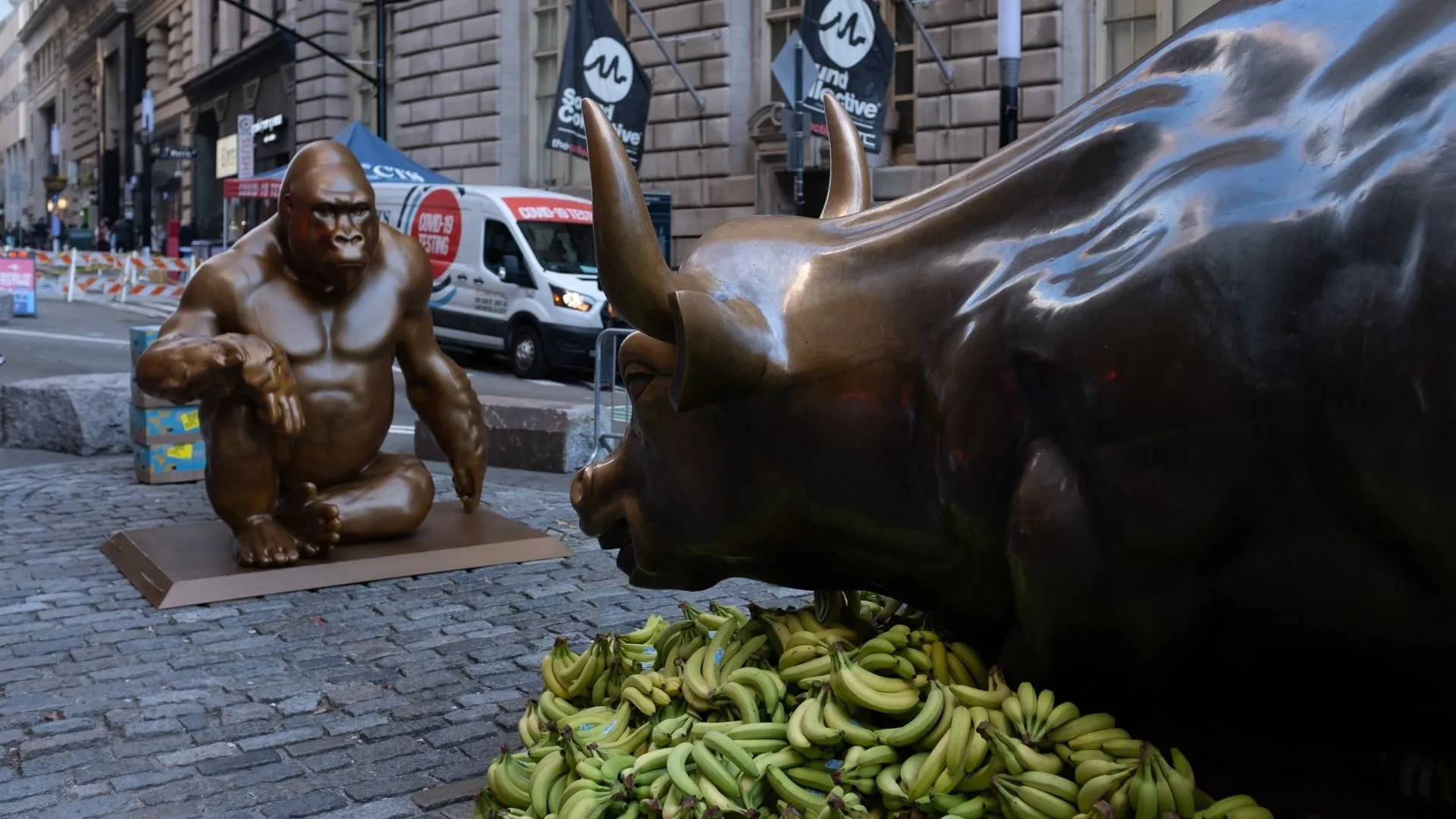 1920x1080 7-foot tall Harambe statue appears opposite of Charging Bull covered in bananas | PIX11