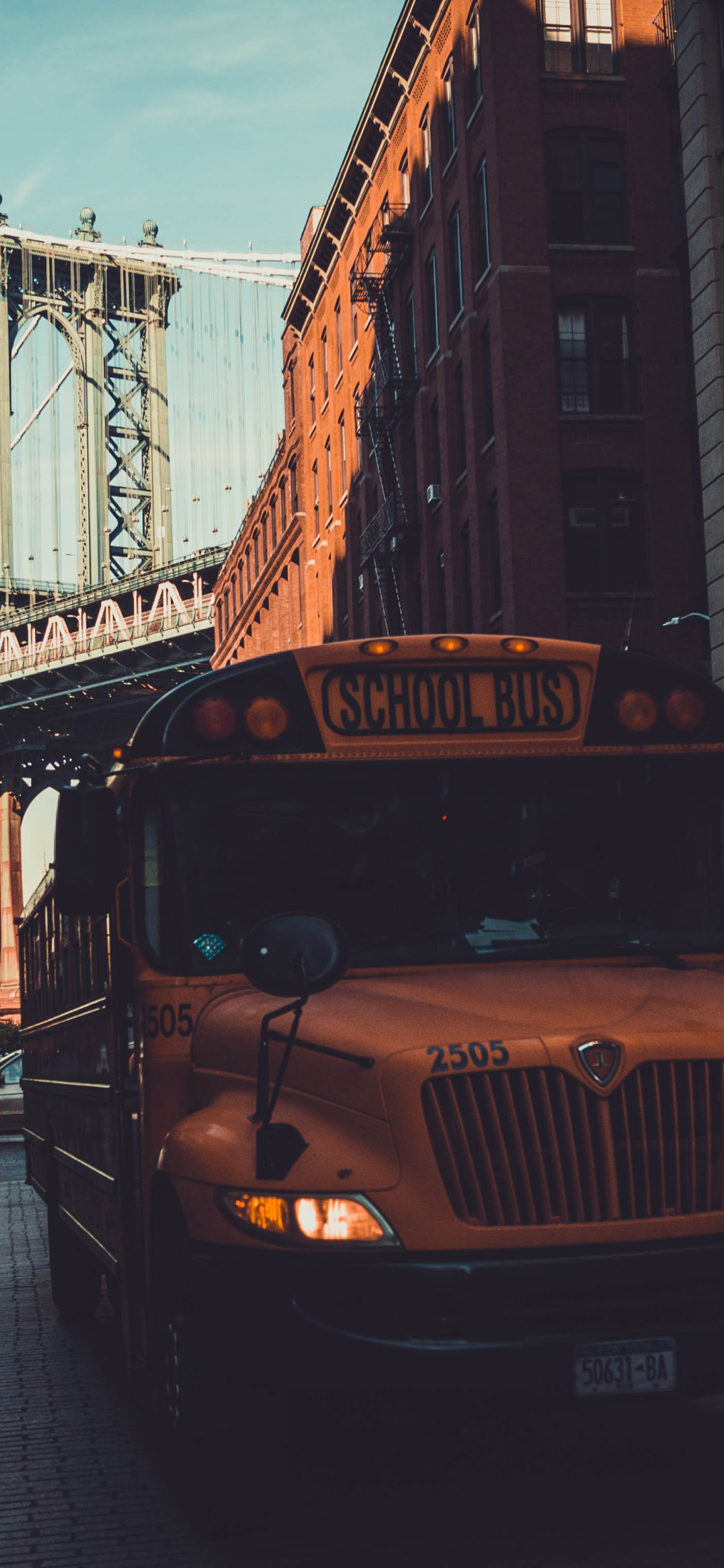 1125x2436 Download school bus, manhattan bridge, city new york wallpaper, iphone x, hd image, background, 690