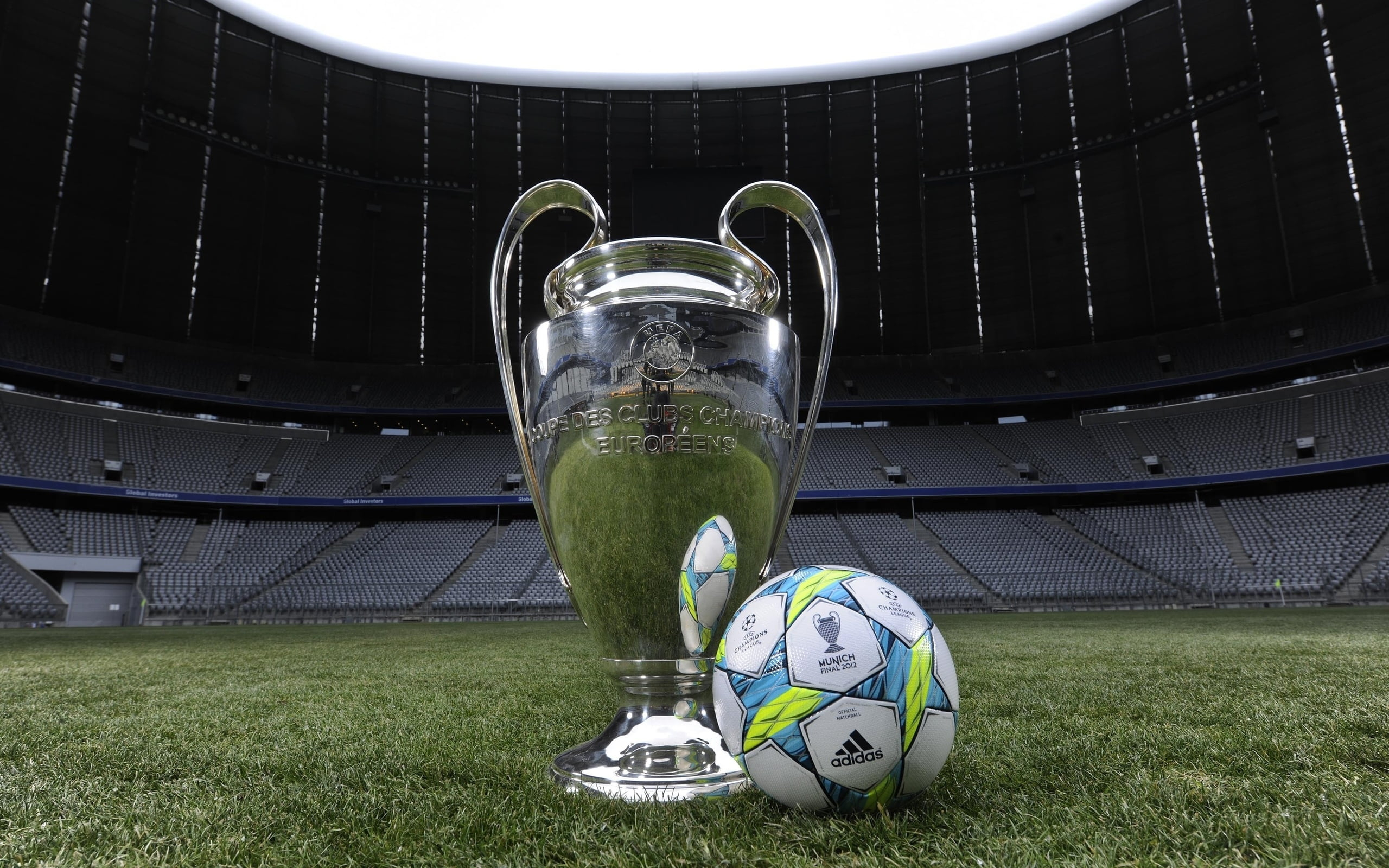 2560x1600 Low-angle photography of silver soccer trophy cup near soccer ball on stadium HD wallpaper